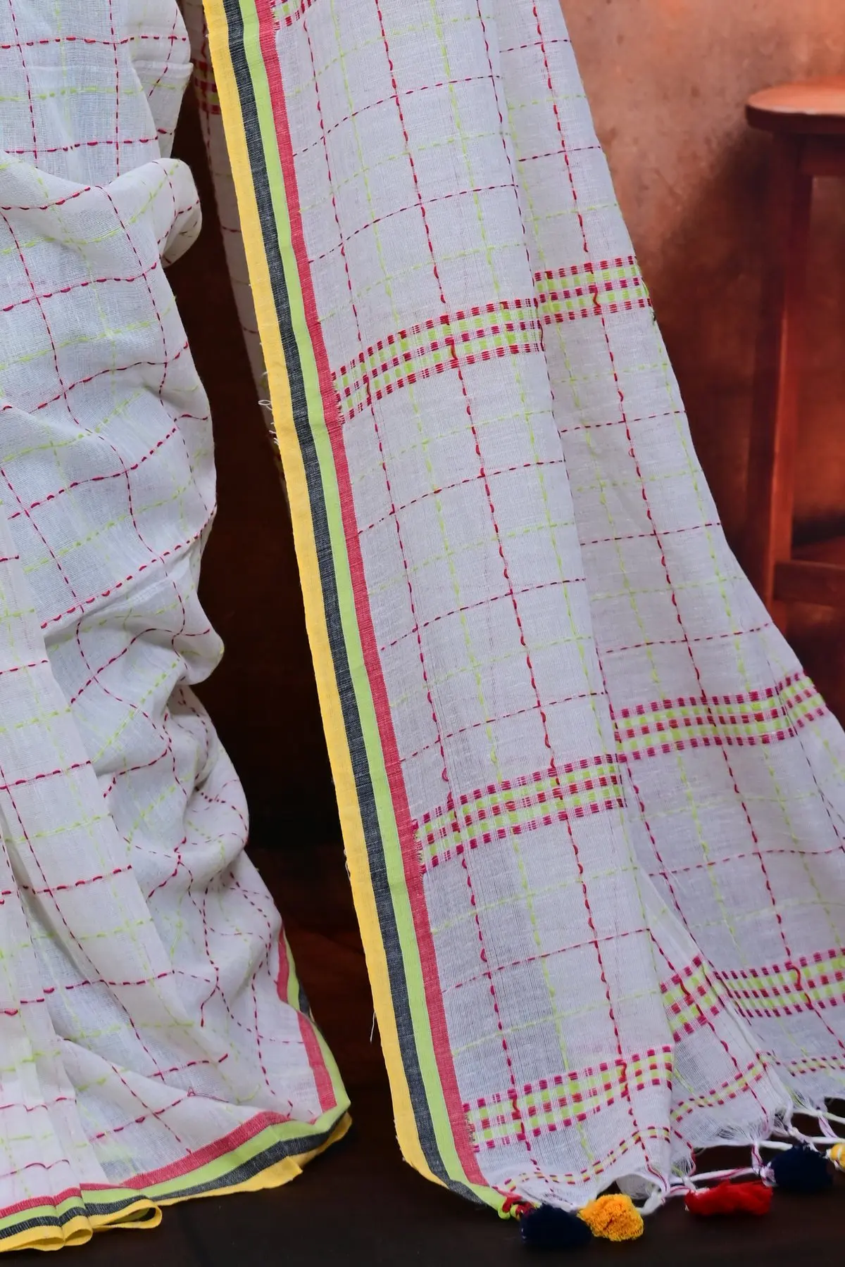 White cotton saree with pink and lime checks, pallu