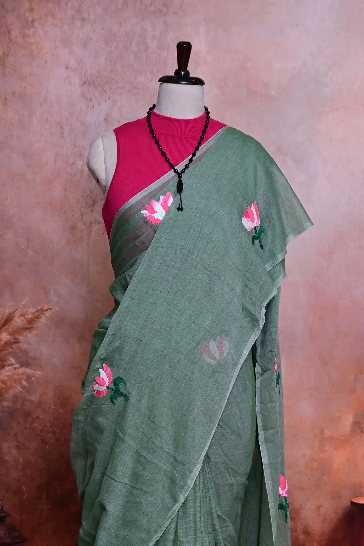 Sage green cotton saree with pink lotus embroidery, 3/4 view