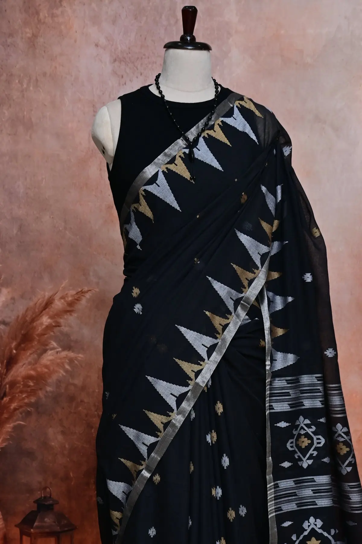 Black cotton saree with silver and gold temple border, 3/4 view