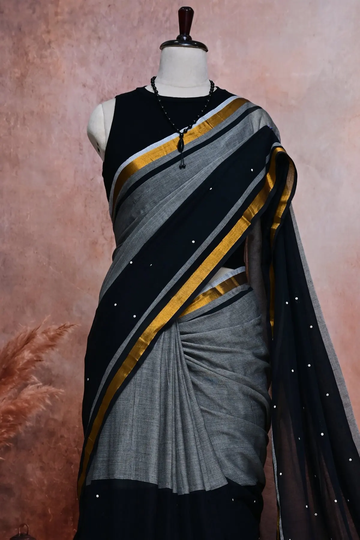 Grey and black cotton saree with gold striped border, 3/4 view
