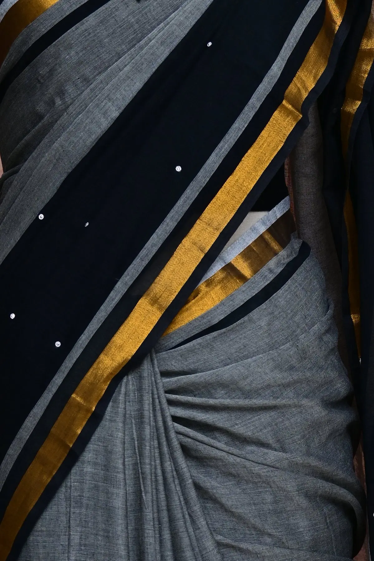 Grey and black cotton saree with gold striped border, border
