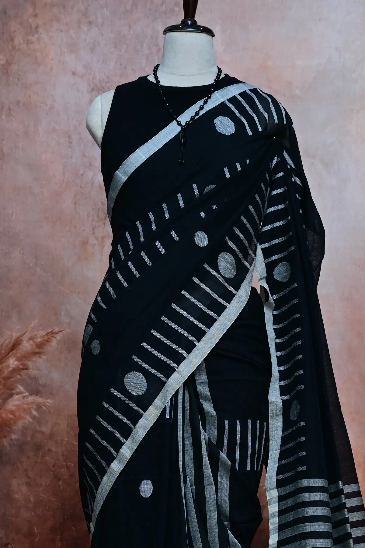 Black cotton saree with white circles and stripes, 3/4 view