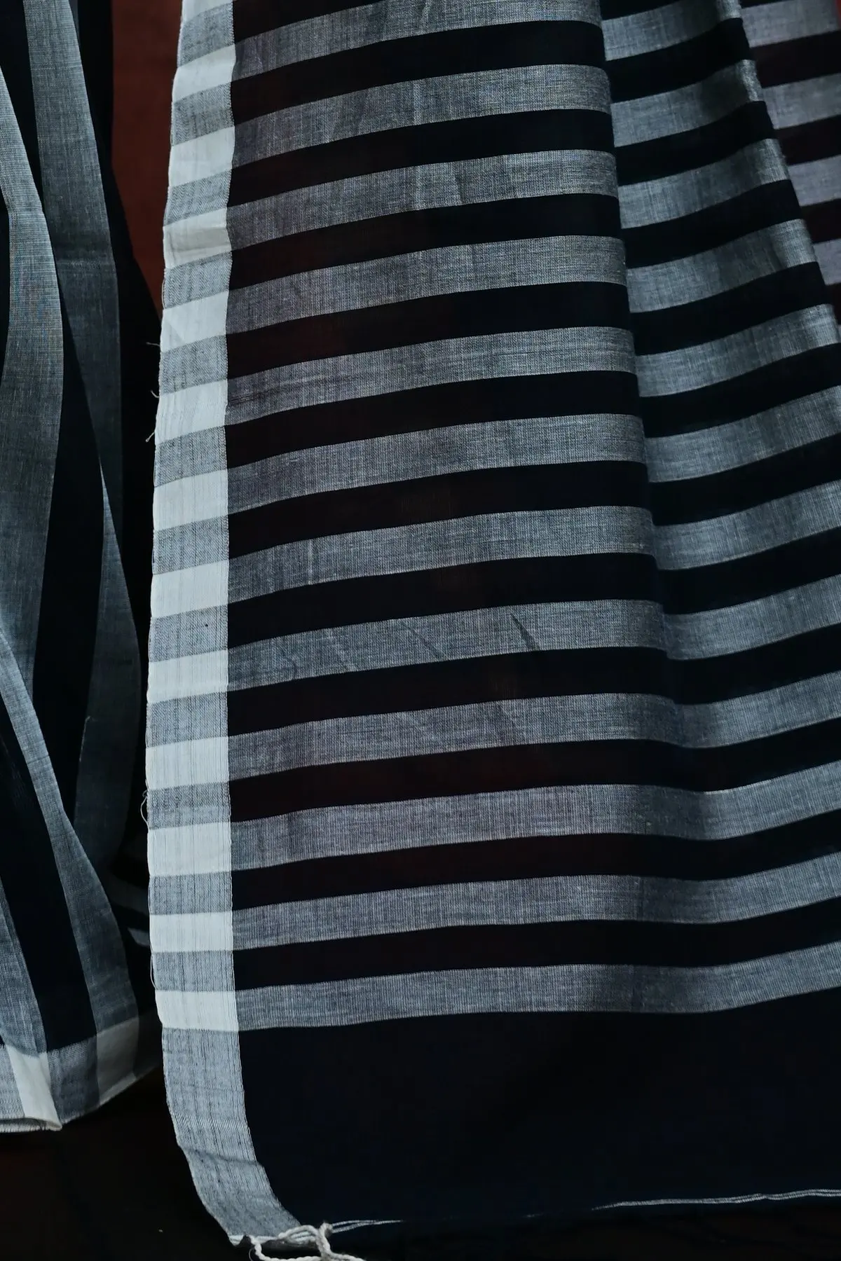 Black cotton saree with white circles and stripes, pallu