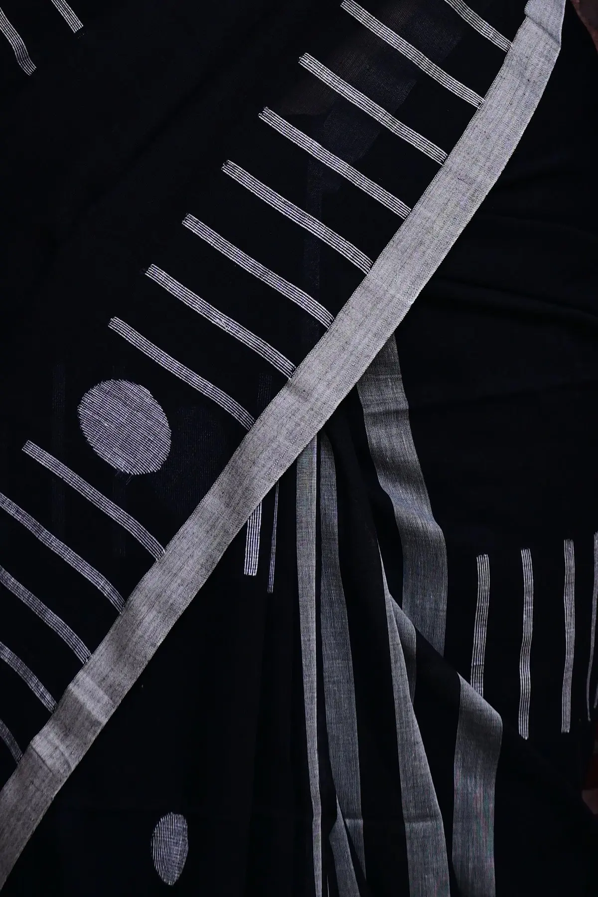 Black cotton saree with white circles and stripes, border