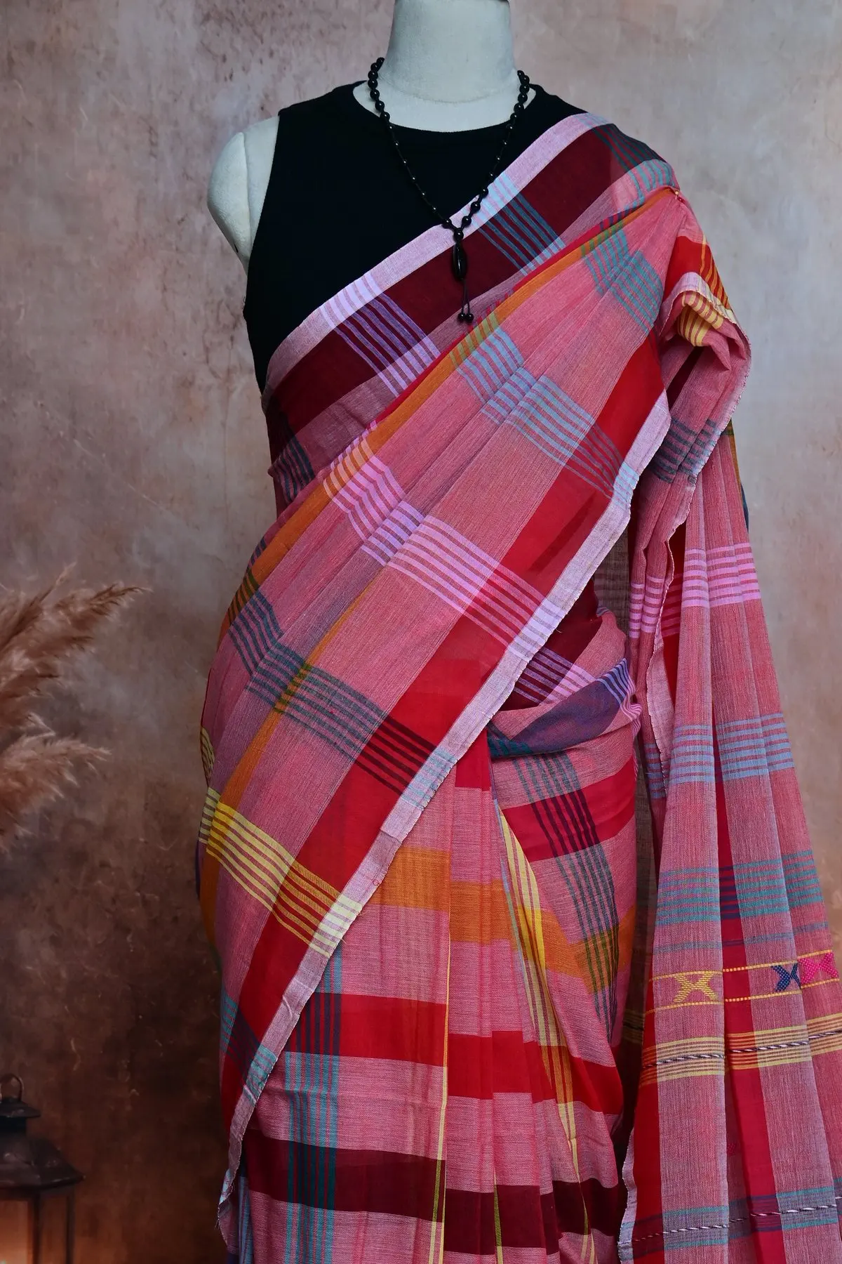 Pink plaid cotton saree with geometric motifs, 3/4 view
