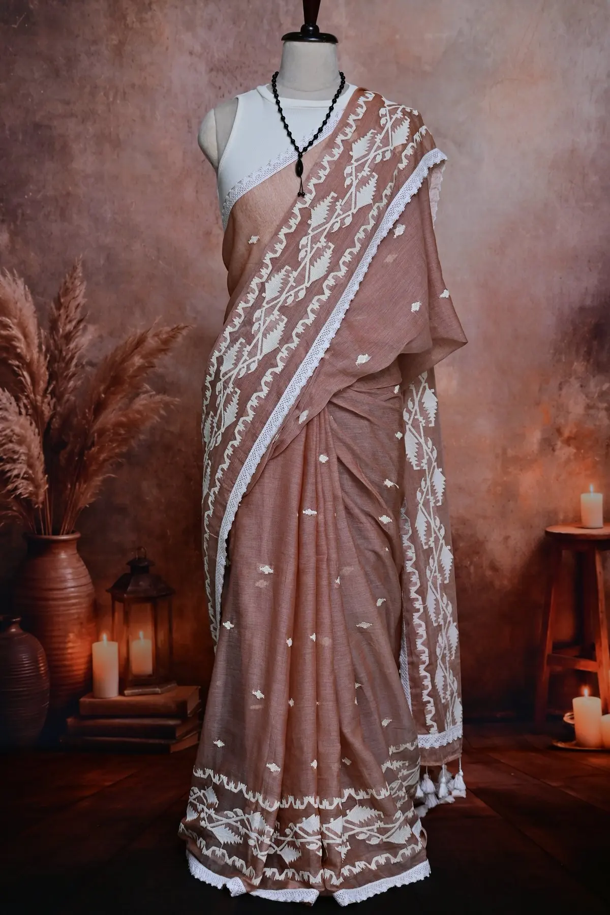 Dusty rose cotton pleats with small white motifs and a white patterned border edged in lace.