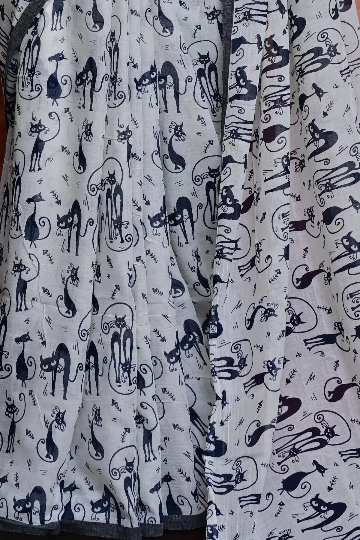 White cotton saree with navy cat print, overall view