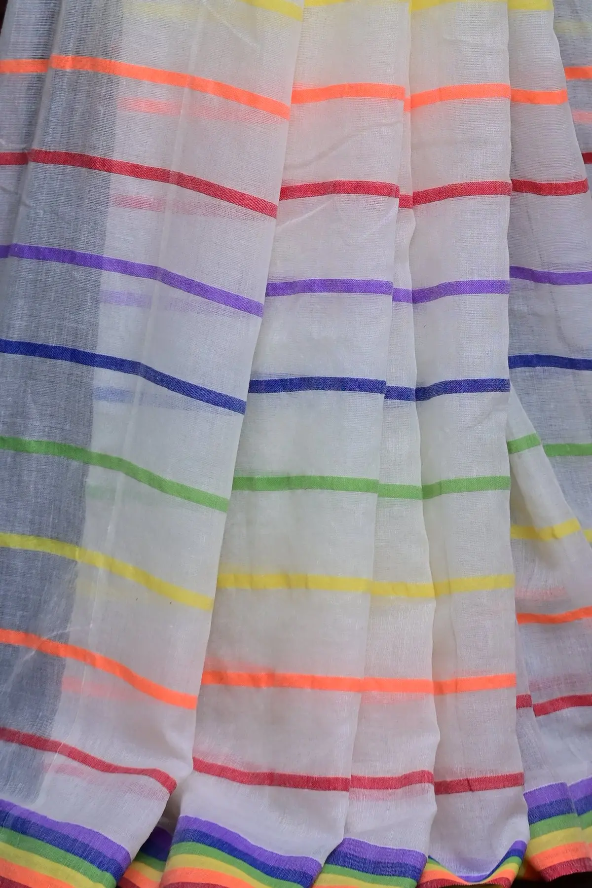 White cotton saree with rainbow stripes, border