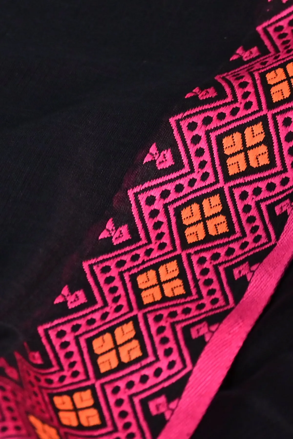 Black cotton saree with pink geometric pallu, border