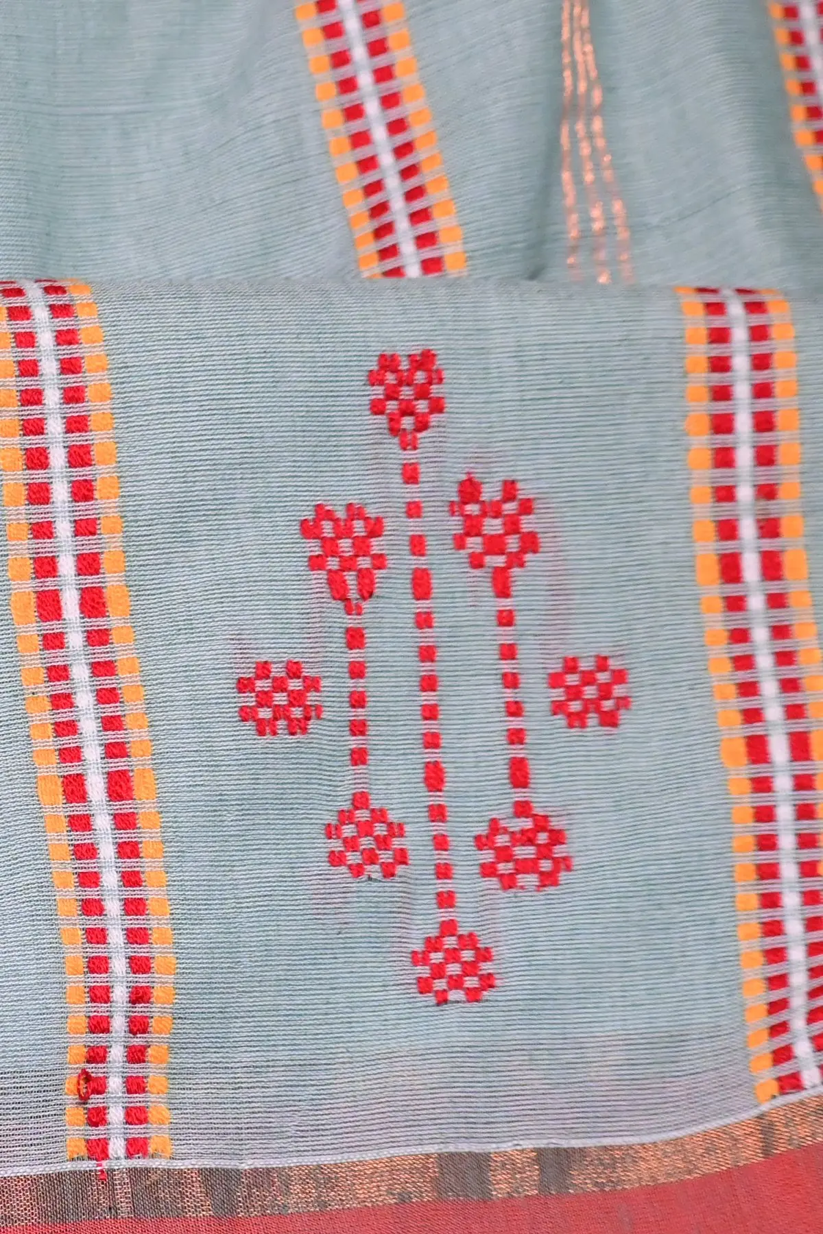 Sage cotton saree with red border and ladder stripes, close-up