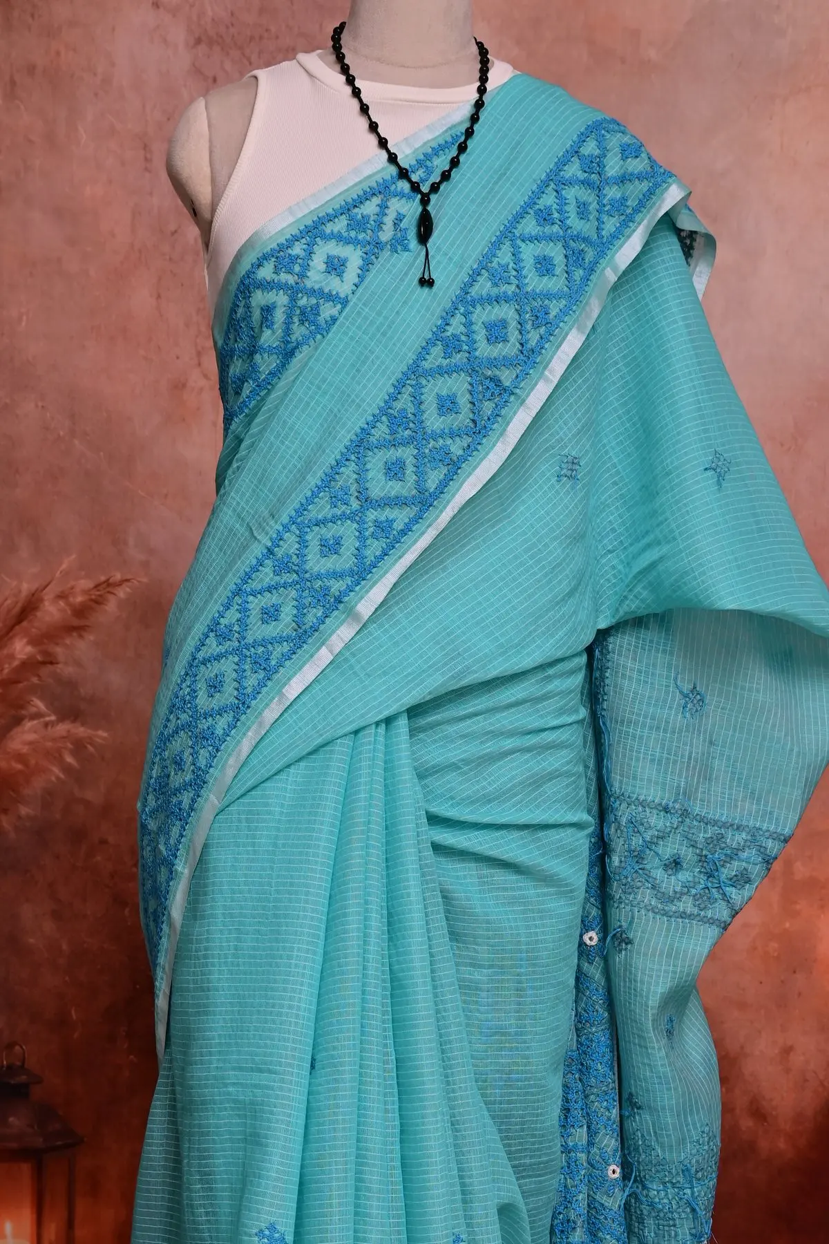 Aqua cotton saree with blue embroidered border, 3/4 view