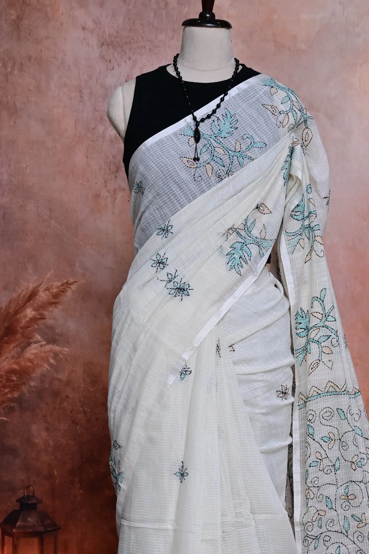 Off-white cotton saree with teal embroidered vines, 3/4 view