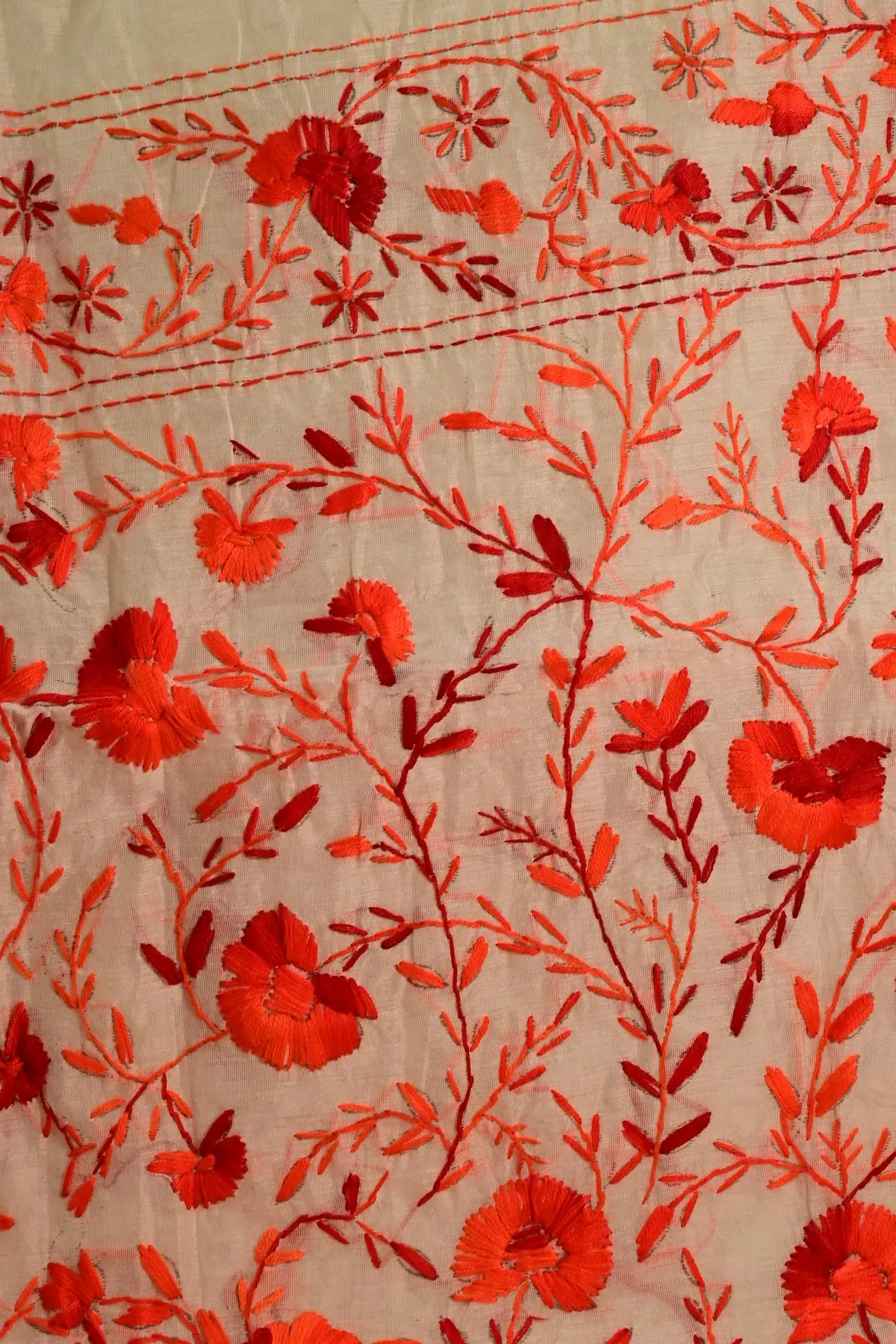 Ivory saree with red floral vine embroidery, pallu