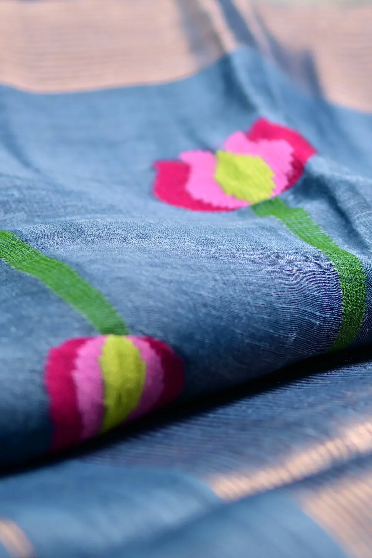 Blue linen saree with lotus motifs, texture