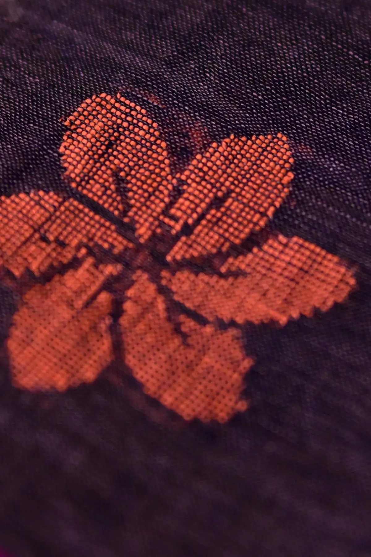 Aubergine linen saree with floral motifs, close-up