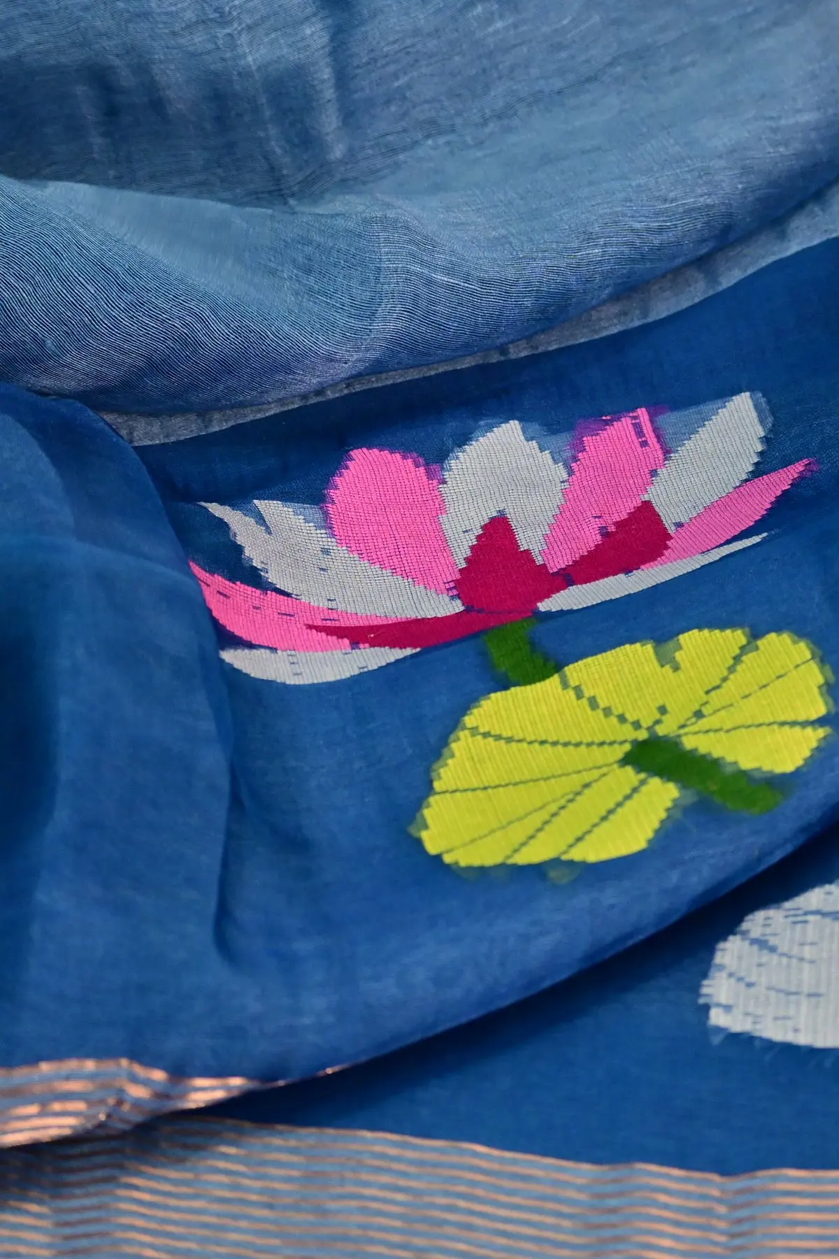 Light blue linen saree with lotus and swan motifs, pallu